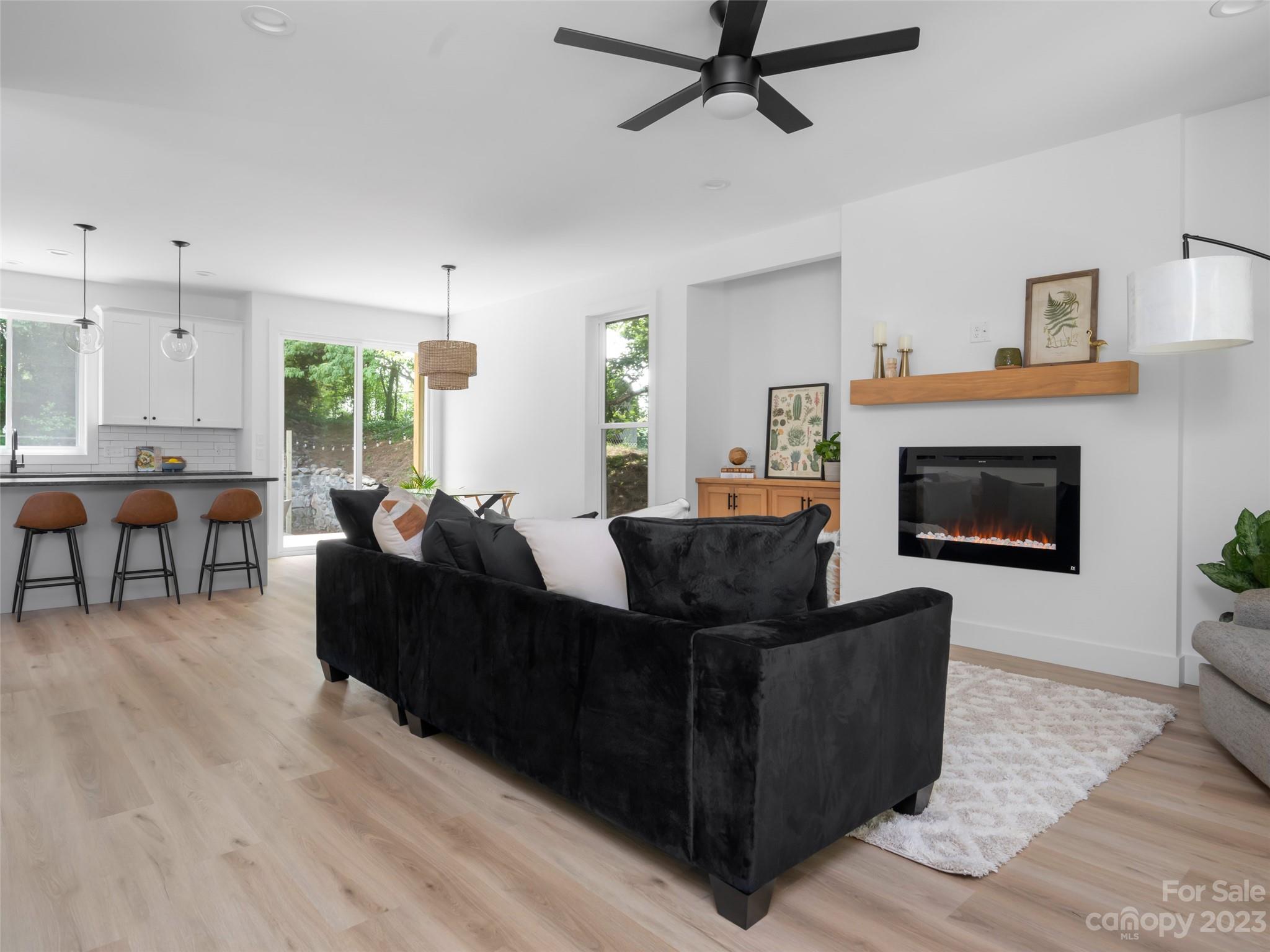 67 Raleigh Road Asheville, NC 28803 - Photo 10 of 43 a living room with furniture and a fireplace