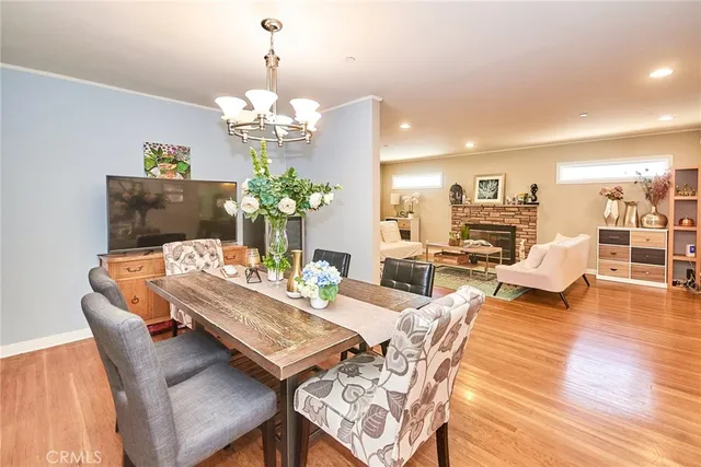 a large kitchen with kitchen island granite countertop a large counter top space a sink stainless steel appliances and cabinets