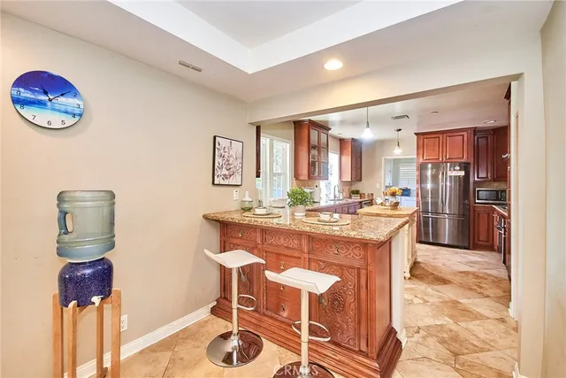a view of a hallway with wooden floor and windows