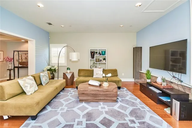 a bathroom with a double vanity sink mirror and shower