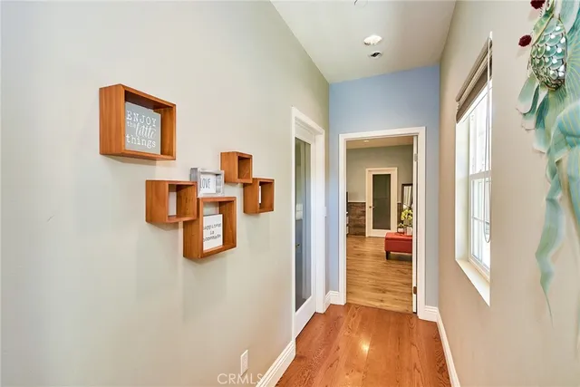 a bathroom with a granite countertop sink mirror vanity and toilet