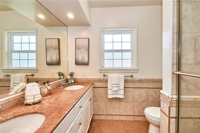 a bedroom with a bed and a television