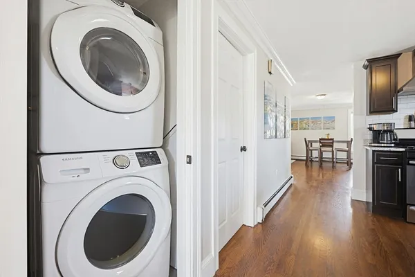 a view of a hallway with washer and dryer