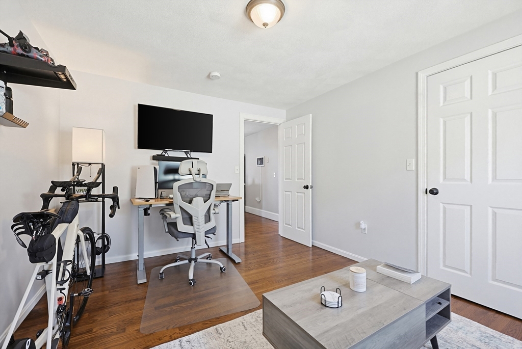 48 Calumet Street, Unit 2 Revere, MA 02151 - Photo 15 of 30 a view of a workspace with furniture and a flat screen tv