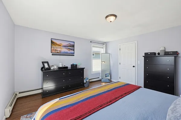a bed room with a bed and a television