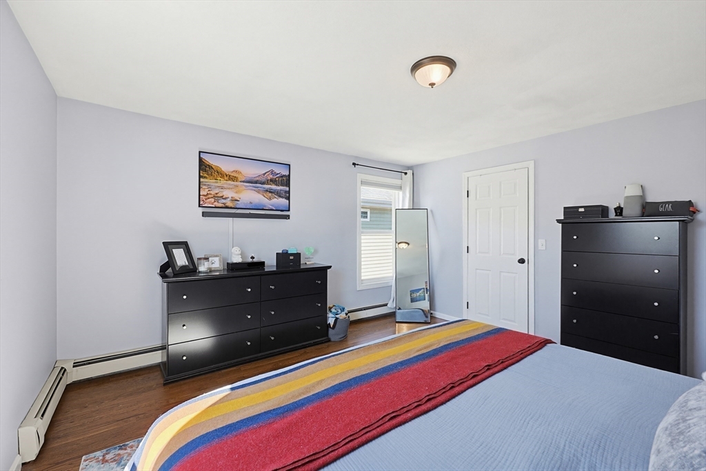 48 Calumet Street, Unit 2 Revere, MA 02151 - Photo 20 of 30 a bed room with a bed and a television