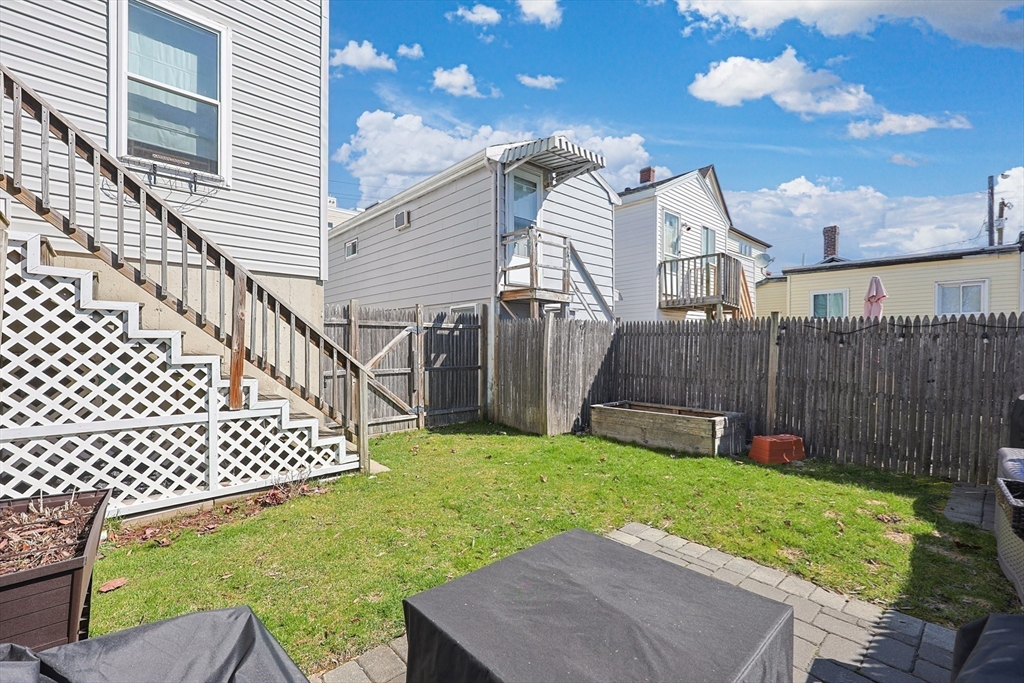 48 Calumet Street, Unit 2 Revere, MA 02151 - Photo 24 of 30 a view of a backyard with a garden