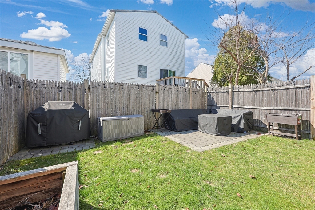 48 Calumet Street, Unit 2 Revere, MA 02151 - Photo 27 of 30 a view of a chair and table in backyard