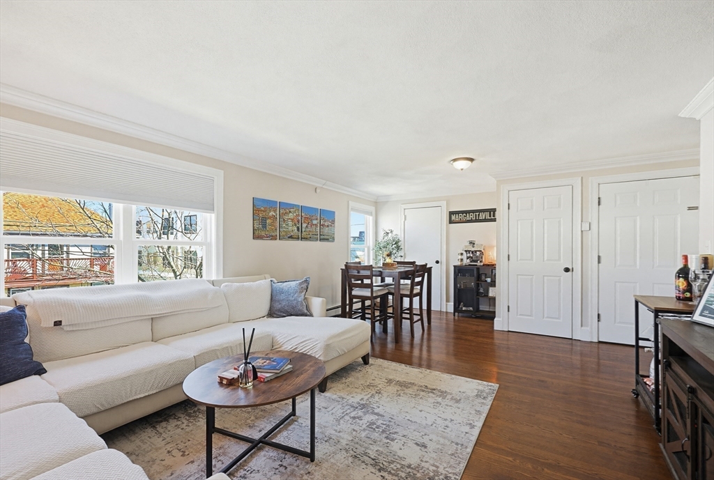 48 Calumet Street, Unit 2 Revere, MA 02151 - Photo 3 of 30 a living room with furniture a wooden floor and a window