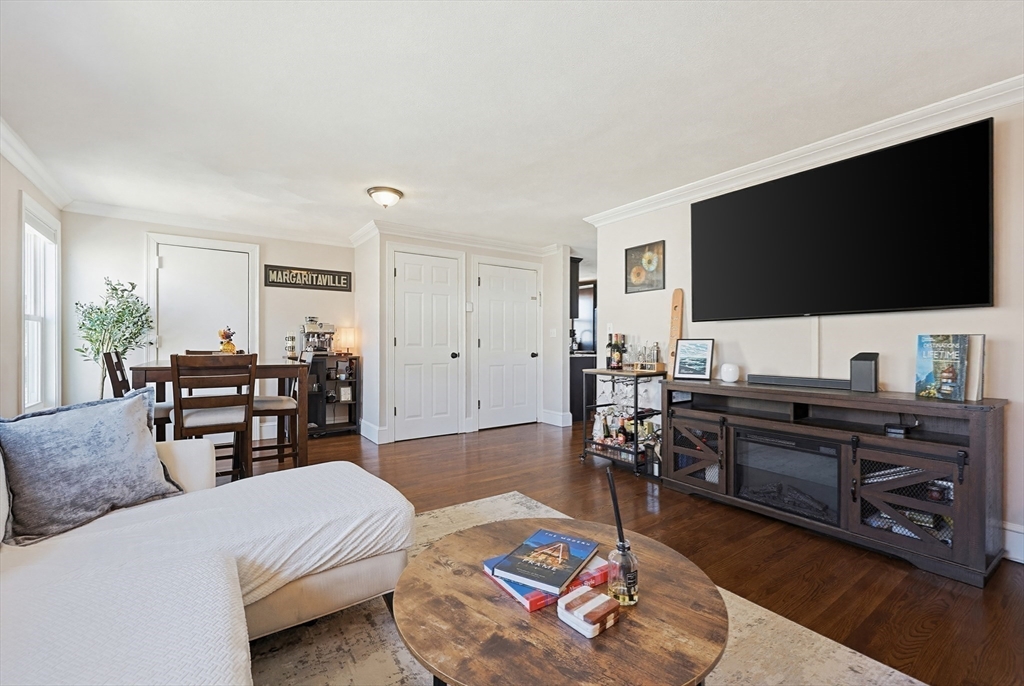 48 Calumet Street, Unit 2 Revere, MA 02151 - Photo 4 of 30 a living room with furniture and a flat screen tv