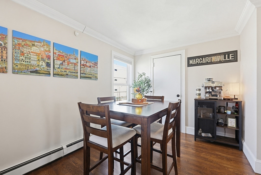 48 Calumet Street, Unit 2 Revere, MA 02151 - Photo 6 of 30 a view of a dining room with furniture and wooden floor