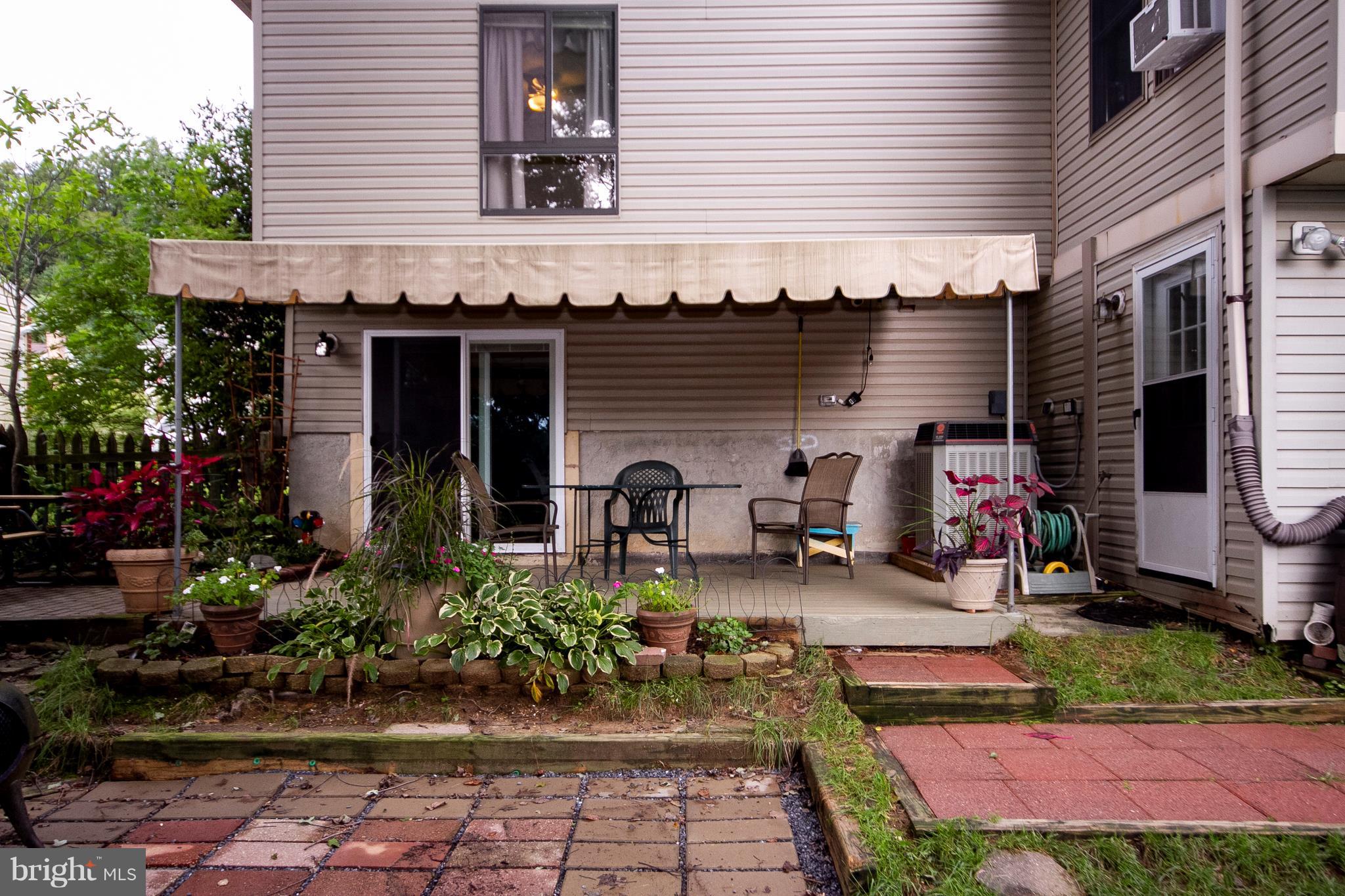 9513 Hallhurst Road Baltimore, MD 21236 - Photo 28 of 30 a front view of a house with patio