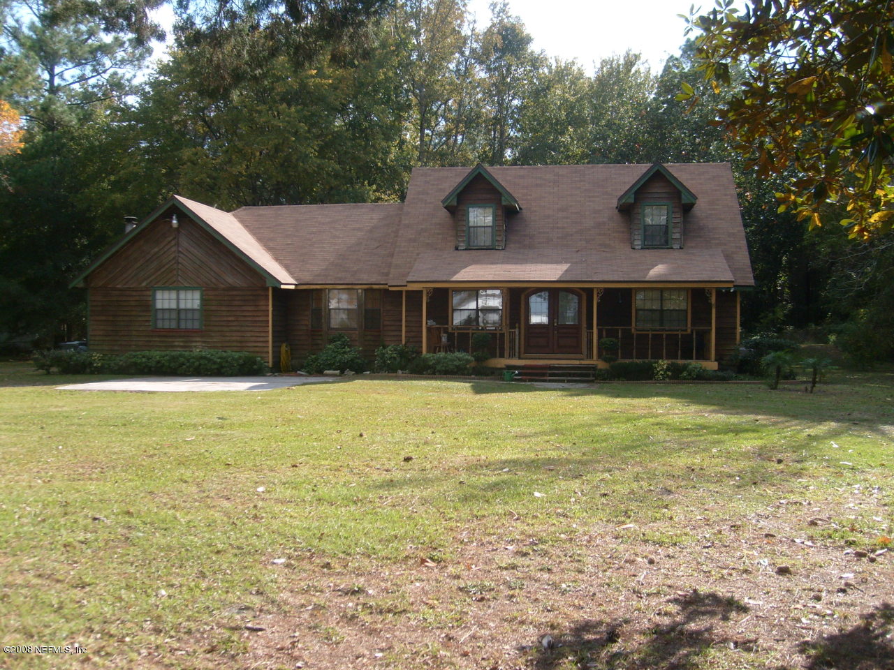 45208 Bismark Road Callahan, FL 32011 - Photo 2 of 7 a front view of a house with a yard