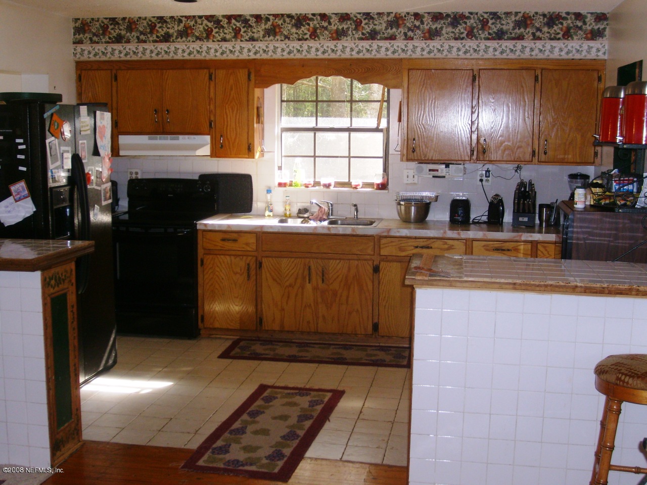 45208 Bismark Road Callahan, FL 32011 - Photo 5 of 7 a kitchen with granite countertop lots of counter top space