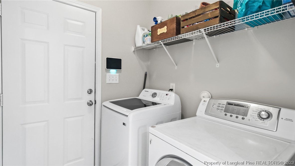 2219 Gray Goose Loop Fayetteville, NC 28306 - Photo 14 of 36 a utility room with dryer and washer
