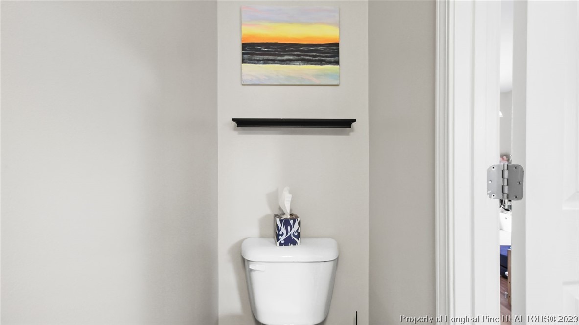 2219 Gray Goose Loop Fayetteville, NC 28306 - Photo 17 of 36 a bathroom with a sink and a mirror