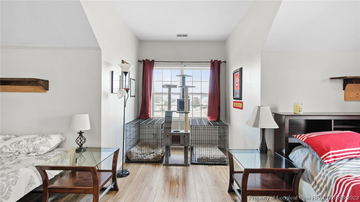 2219 Gray Goose Loop Fayetteville, NC 28306 - Photo 20 of 36 a living room with furniture and a floor to ceiling window