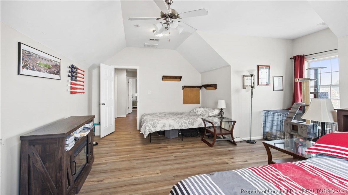 2219 Gray Goose Loop Fayetteville, NC 28306 - Photo 21 of 36 a bedroom with furniture and wooden floor
