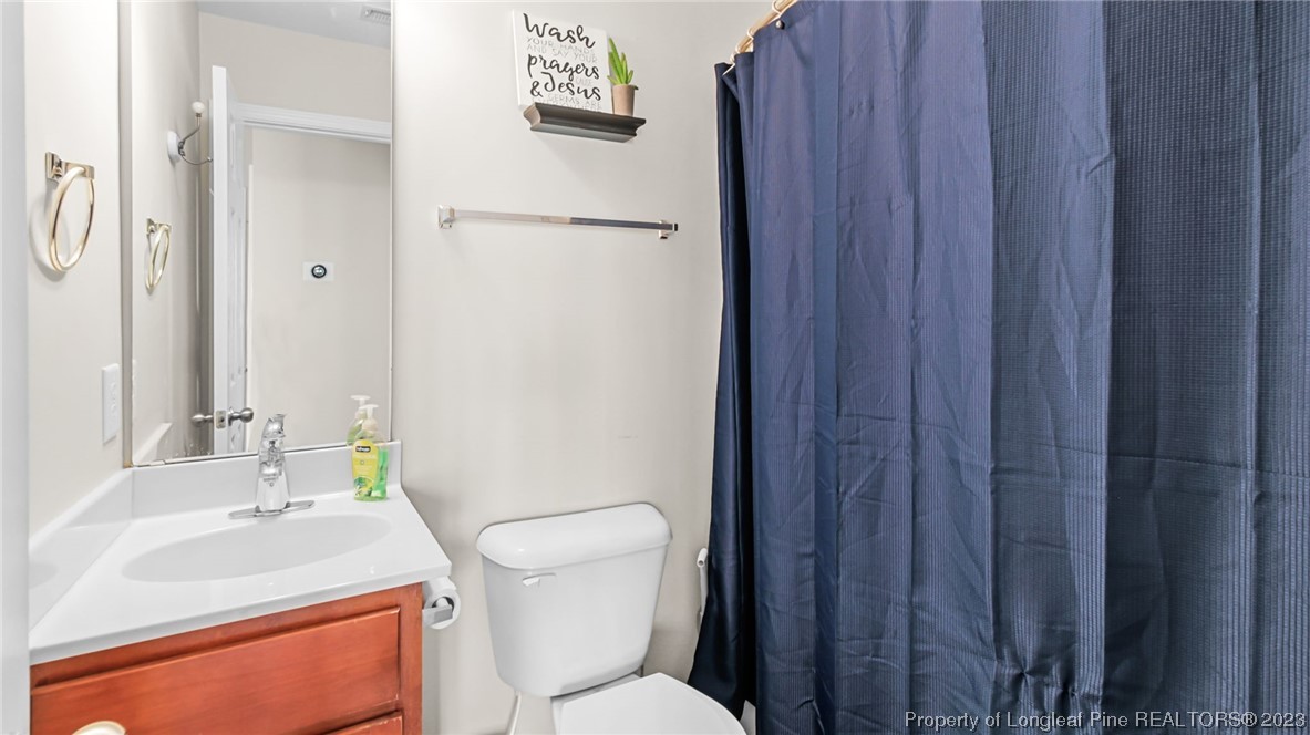 2219 Gray Goose Loop Fayetteville, NC 28306 - Photo 22 of 36 a bathroom with a sink toilet and shower