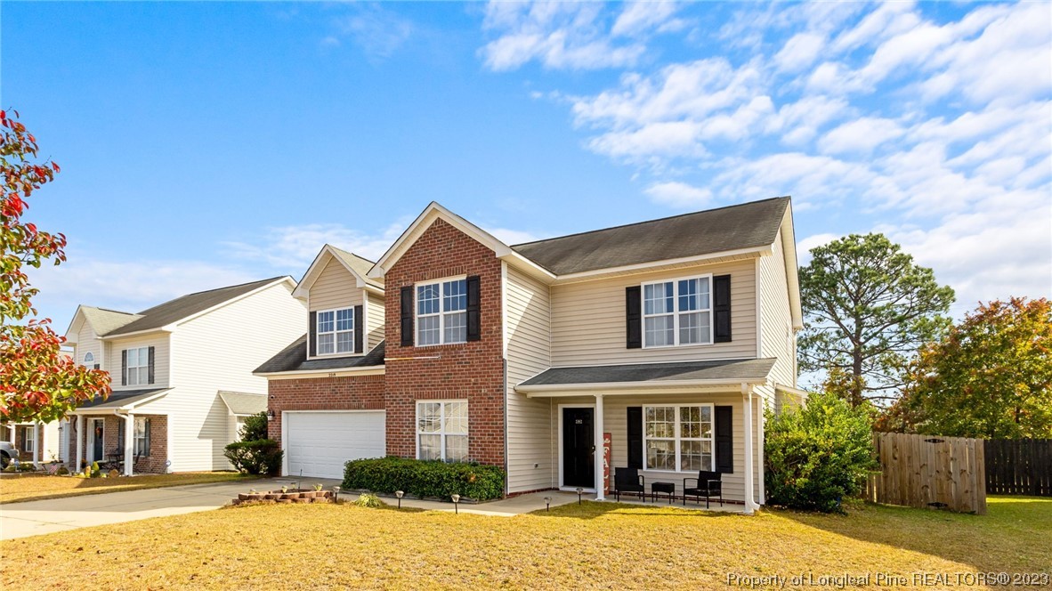 2219 Gray Goose Loop Fayetteville, NC 28306 - Photo 3 of 36 a front view of a house with a yard