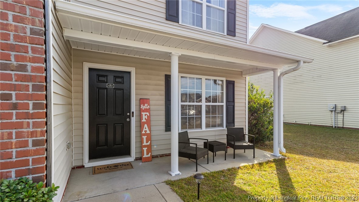 2219 Gray Goose Loop Fayetteville, NC 28306 - Photo 5 of 36 a view of a patio with table and chairs and potted plants