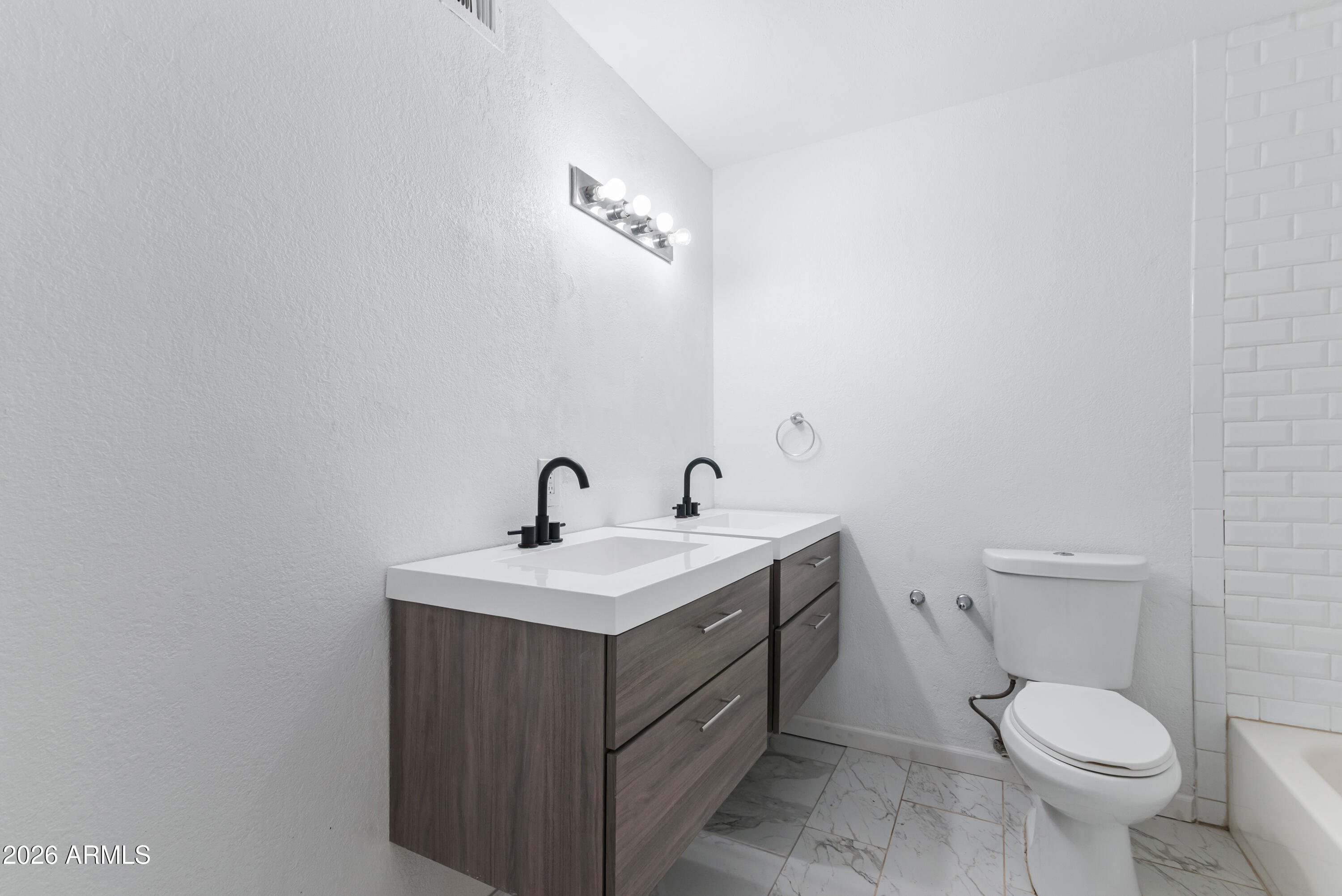 860 West McLellan Road Mesa, AZ 85201 - Photo 17 of 26 a bathroom with a toilet a sink and mirror