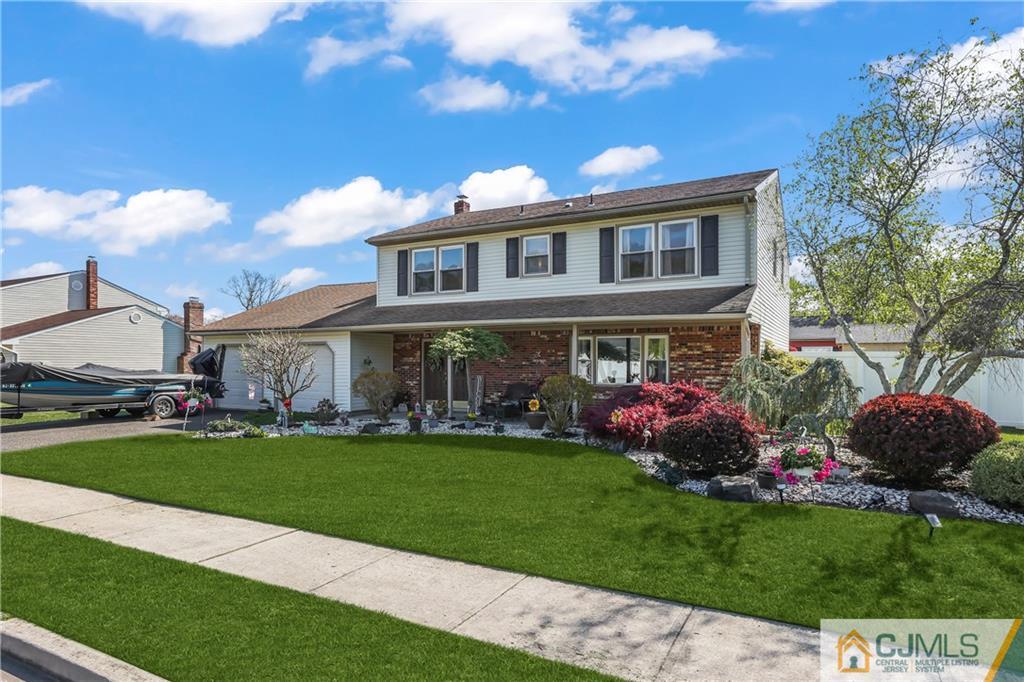 49 South Rhoda Street Monroe Township, NJ 08831 - Photo 1 of 11 a front view of house with yard and outdoor seating