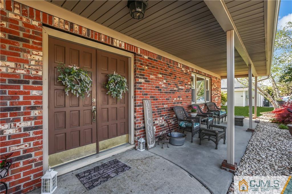 49 South Rhoda Street Monroe Township, NJ 08831 - Photo 2 of 11 a patio with table and chairs