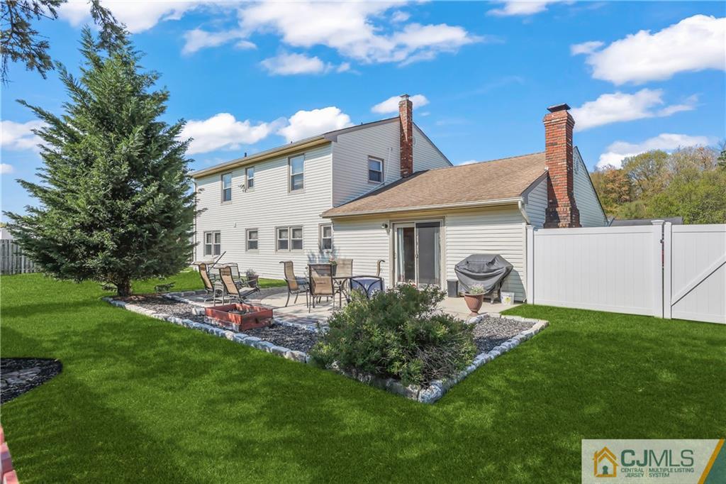 49 South Rhoda Street Monroe Township, NJ 08831 - Photo 8 of 11 a view of a house with backyard and sitting area