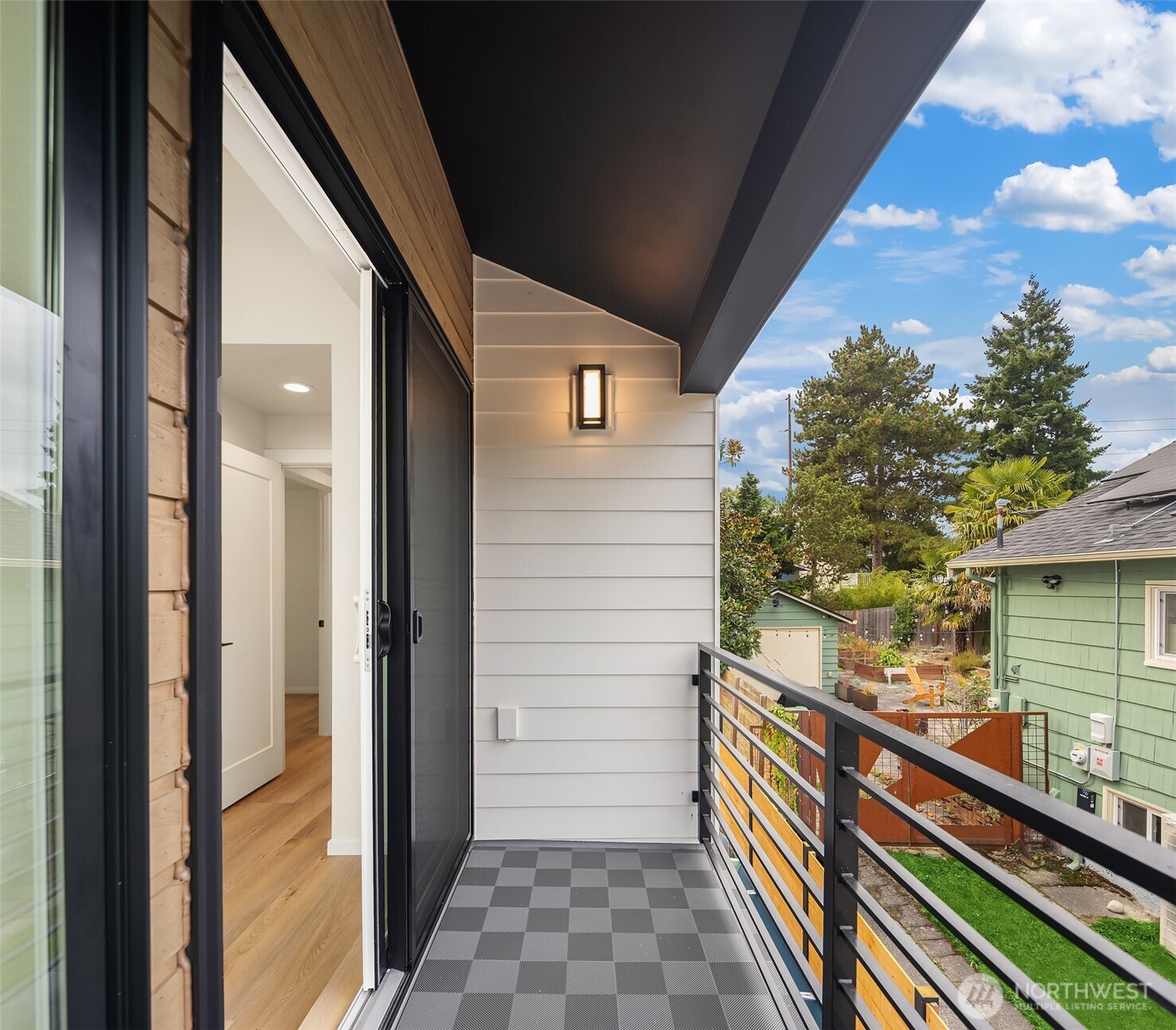 6503 Dibble Avenue Northwest Seattle, WA 98117 - Photo 14 of 15 a balcony view with a glass door