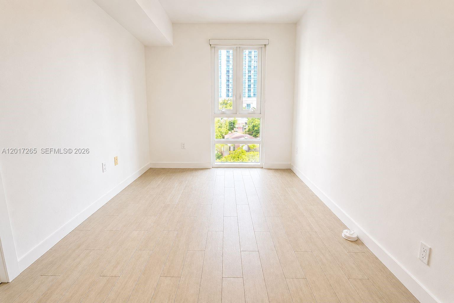 321 Northeast 26th Street, Unit 515 Miami, FL 33137 - Photo 5 of 7 a view of an entryway with wooden floor