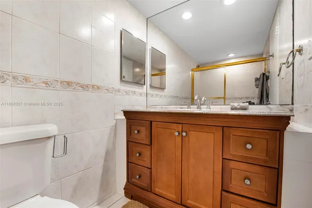 a bedroom with double bed and a large window