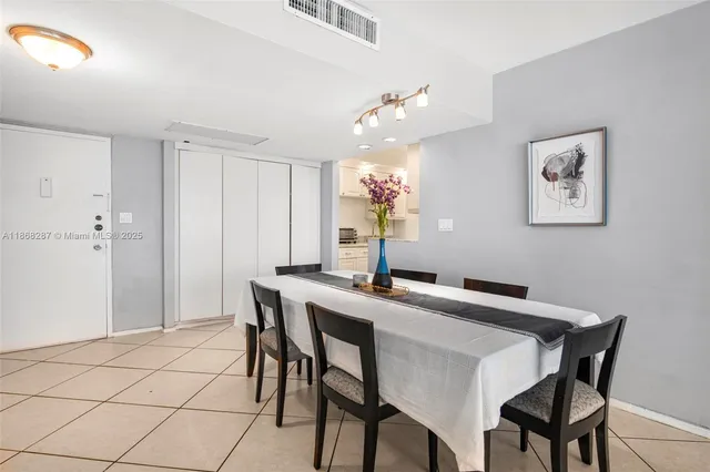 a kitchen with kitchen island granite countertop a sink stainless steel appliances and cabinets