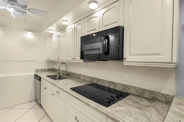 a bedroom with two beds and a large window