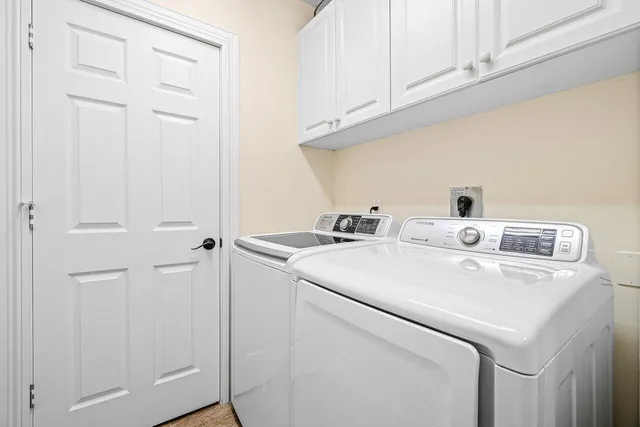 a city street lined with buildings and cars parked