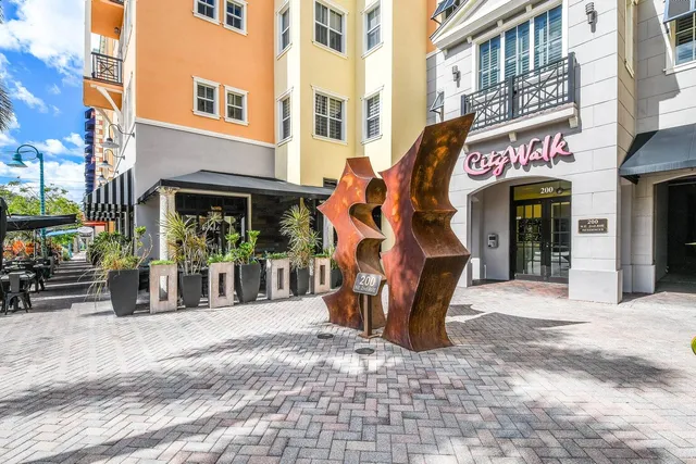 a front view of a building with a yard