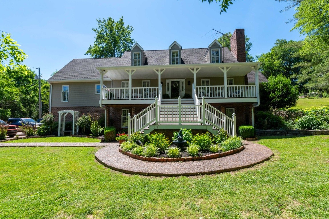 1637 North Greenhill Road Mount Juliet, TN 37122 - Photo 1 of 35 a front view of a house with a yard