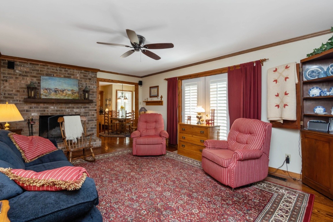 1637 North Greenhill Road Mount Juliet, TN 37122 - Photo 5 of 35 a living room with furniture or couch and a fireplace