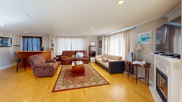 a living room with furniture rug and window