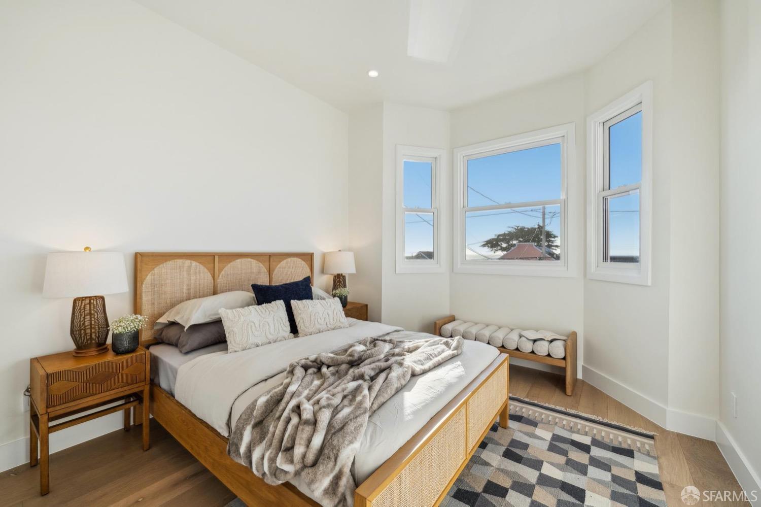 1544 45th Avenue San Francisco, CA 94122 - Photo 28 of 51 a bedroom with a bed and wooden floor