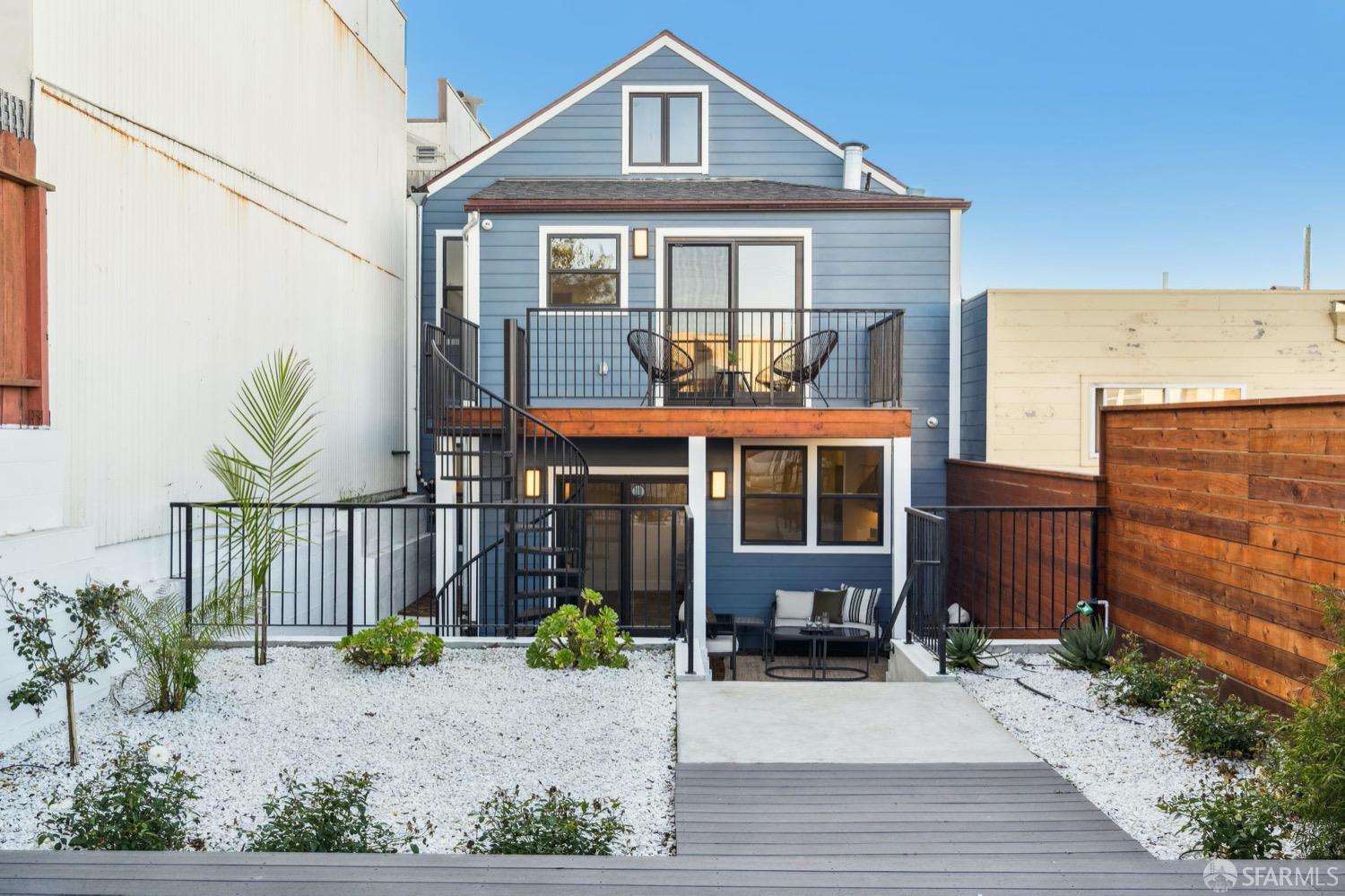 1544 45th Avenue San Francisco, CA 94122 - Photo 39 of 51 a front view of a house with a yard and potted plants
