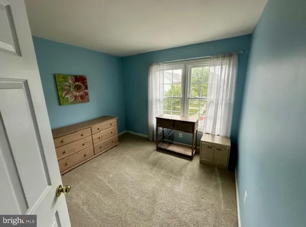 a view of workspace with furniture and window