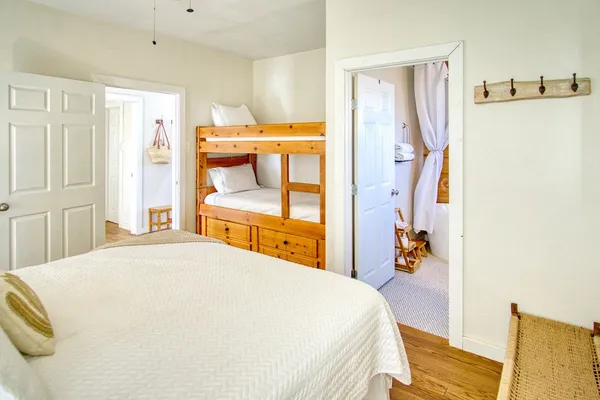a bedroom with a bed and chair