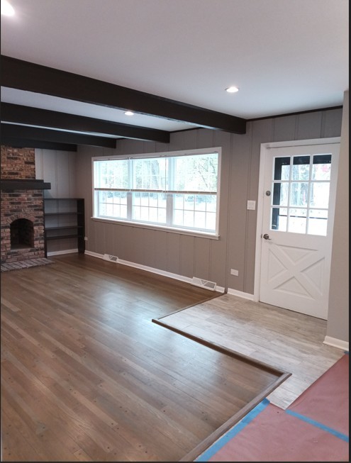 438 Hamilton Wood Homewood, IL 60430 - Photo 12 of 39 an empty room with wooden floor and windows