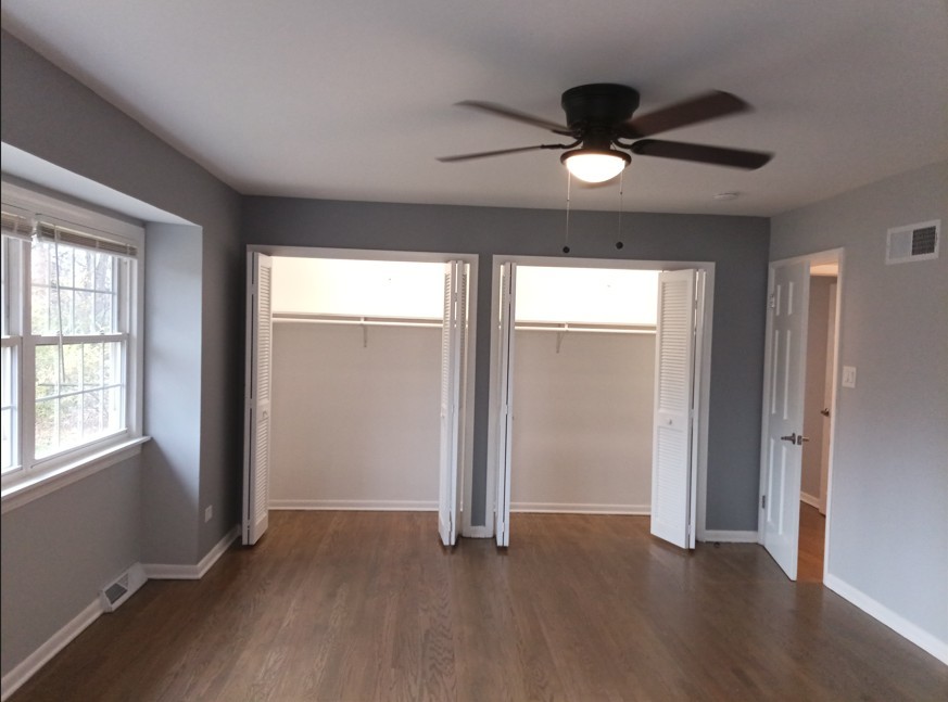 438 Hamilton Wood Homewood, IL 60430 - Photo 23 of 39 a view of an empty room with wooden floor and a window
