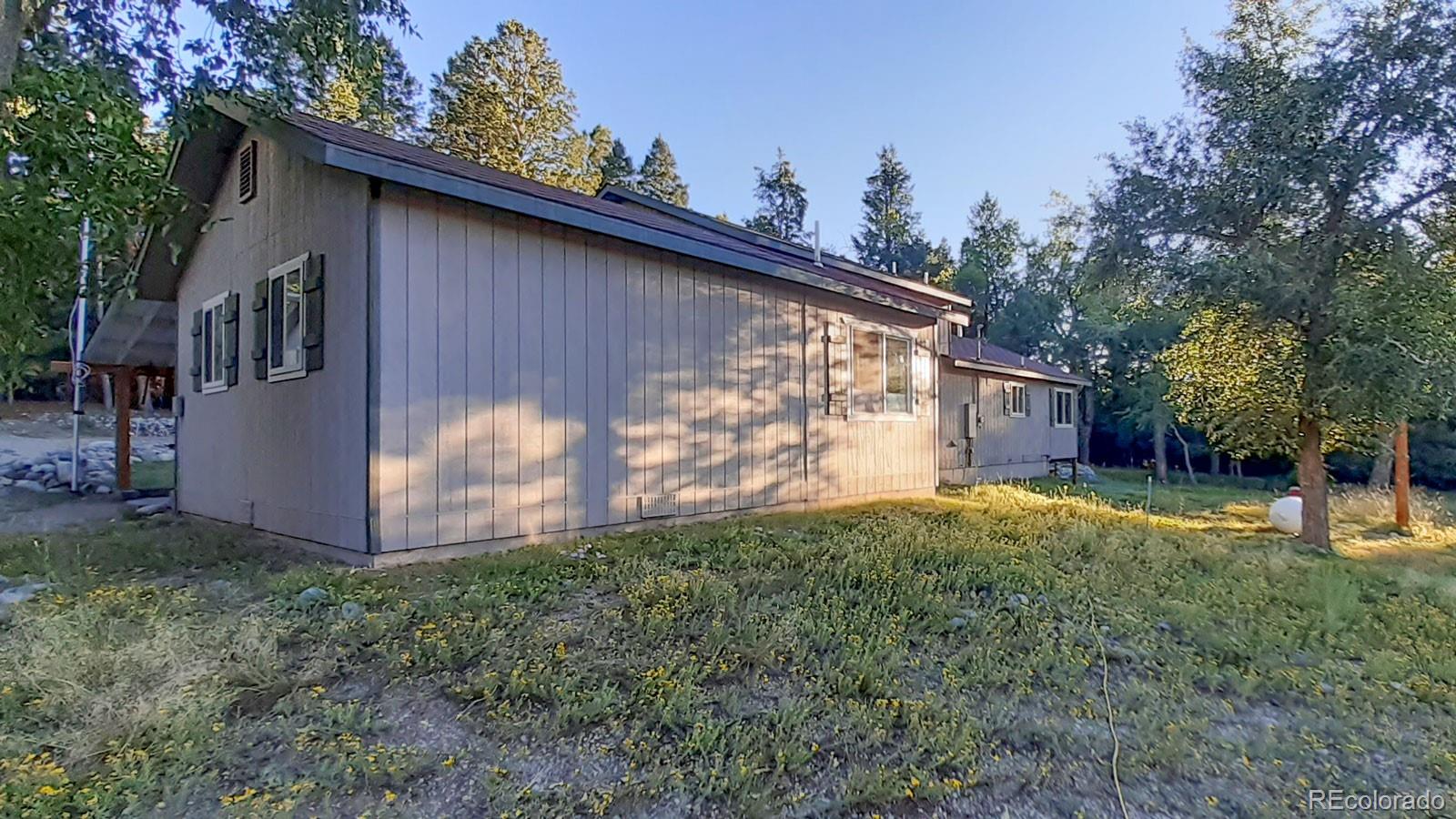 203 Hampton Run Road Mosca, CO 81146 - Photo 27 of 33 a view of backyard of house with trees