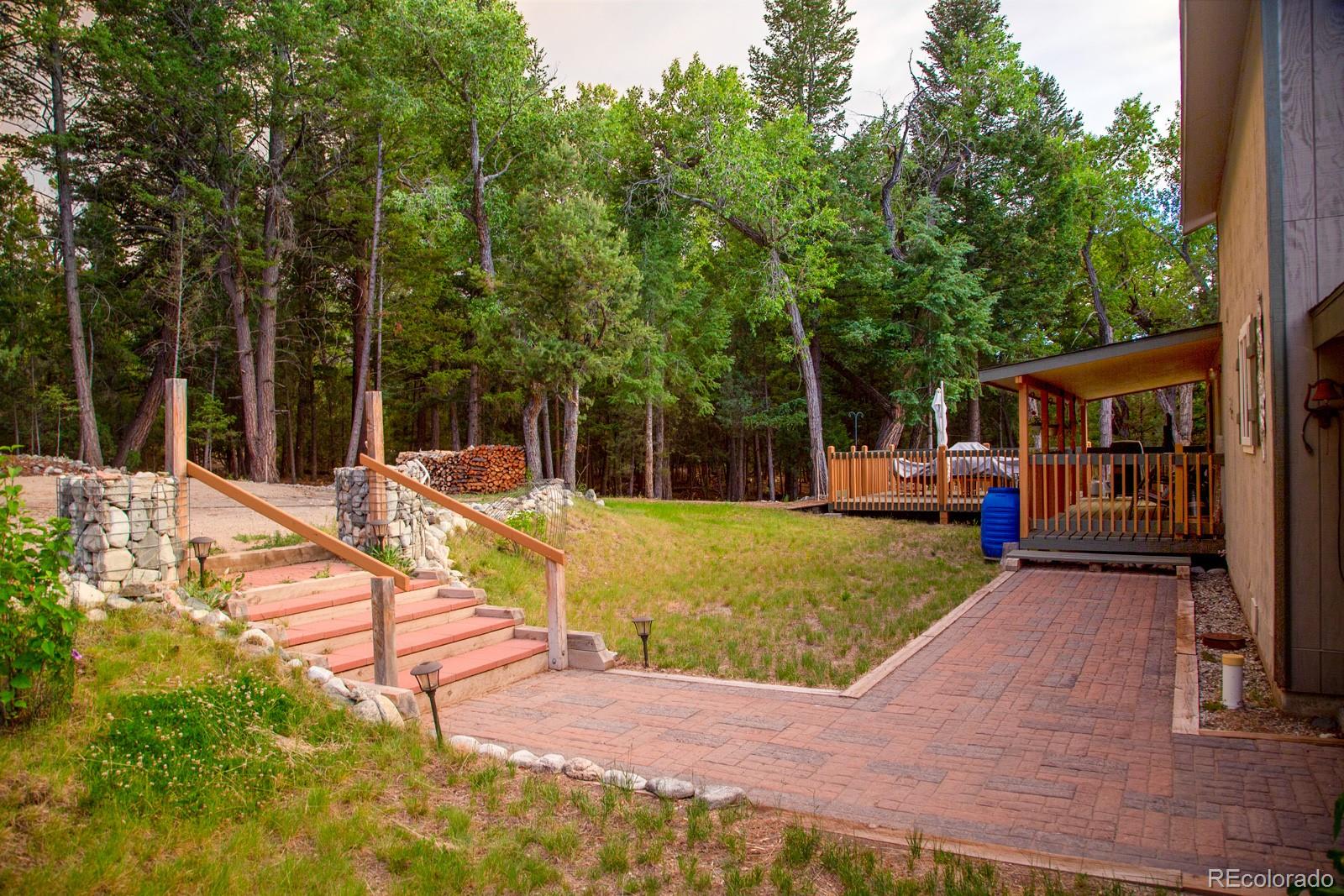 203 Hampton Run Road Mosca, CO 81146 - Photo 5 of 33 a view of a house with swimming pool and sitting area