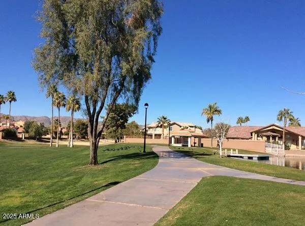 a view of a park with houses