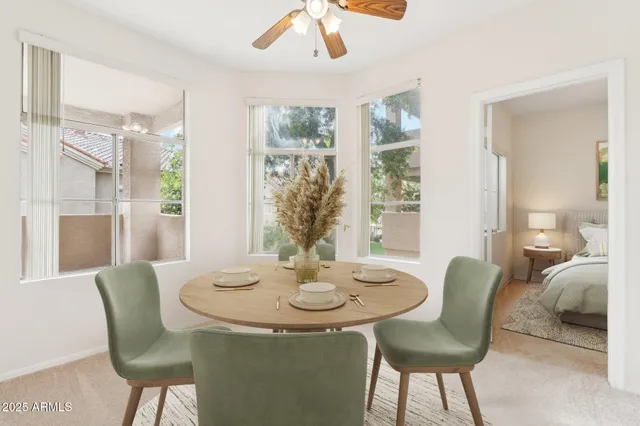 a dining room with furniture and window