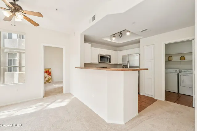 a view of a kitchen with storage and utility